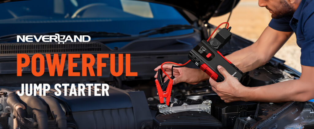 A man repairs his car, showcasing a powerful jump starter beside him.